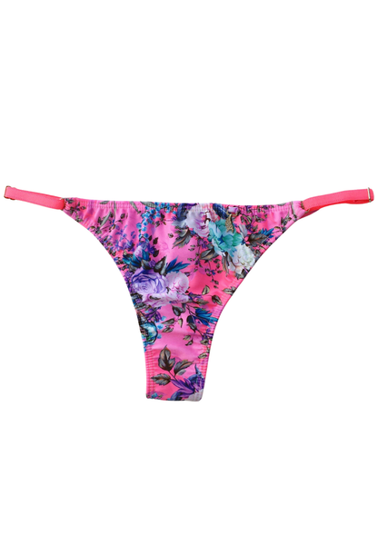 Bombacha de bikini colaless rosa con estampado floral romántico y finas tiras laterales regulables para un ajuste perfecto.